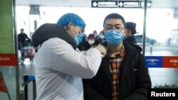 Tedros Adhanom, director-general of the World Health Organization, left, meets with Chinese President Xi Jinping before a meeting at the Great Hall of the People in Beijing, Jan. 28, 2020. 