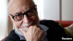 Belgian physicist Francois Englert poses in his home in Brussels, Oct. 8, 2012. 
