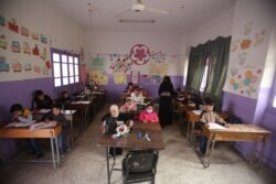 Many children who do attend school in Idlib, Syria, arrive late or leave early because they have to work. Dec. 1, 2020. (VOA)