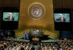 FILE - Then-U.S. Secretary of State John Kerry addresses delegates at a special "High-Level Event on Entry into Force of the Paris Agreement on Climate Change" meeting held at U.N. headquarters in New York, Sept. 21, 2016.