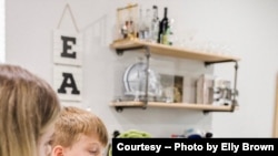 Mom uses telemedicine to talk with Dr. William Chu, medical director of the NightLight Pediatric Urgent Care clinics, Houston, Texas. (Photo courtesy Elly Brown)