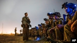 Soldiers, assigned to the 82nd Airborne Division, prepare to board a U.S. Air Force C-17 Globemaster III aircraft in support of the final noncombatant evacuation operation missions at Hamid Karzai International Airport in Kabul, Aug. 30, 2021.