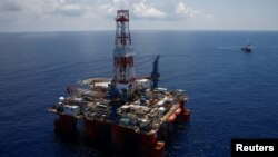 FILE - A general view shows JDC Hakuryu-5 drilling rig and supply vessels in the South China Sea off the coast of Vung Tau, Vietnam April 29, 2018. Picture taken April 29, 2018.