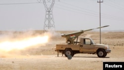 Kurdish security forces fire rocket launcher during clashes with the Islamic State of Iraq and the Levant, Jalawla, Diyala province, Iraq, June 29, 2014.