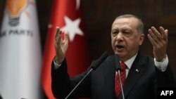 Turkey's president and leader of Turkey's Justice and Development (AK) Party, Recep Tayyip Erdogan, delivers a speech during his party's parliamentary group meeting at the Grand National Assembly of Turkey, in Ankara, Feb. 5, 2019.