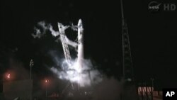 This framegrab from NASA-TV shows the Falcon 9 SpaceX rocket on the launch pad at complex 40 at the Cape Canaveral Air Force Station in Cape Canaveral, Florida, seconds after the launch was aborted due to technical problems early Saturday May 19, 2012.