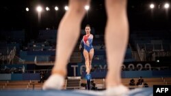 Gymnasts from Netherlands practice on the balance beam during a training session at the Ariake Gymnastics Center in Tokyo on July 22, 2021, prior to the beginning of the 2020 Tokyo Olympic Games.