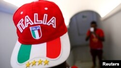 An adolescent migrant poses for a picture at an immigration centre in the Sicilian town of Caltagirone, Italy on April 20, 2016. 