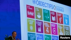 FILE - The 17 goals of the 2030 Agenda for Sustainable Development are seen behind then-U.N. Secretary-General Ban Ki-Moon at the Annual Conference of Swiss Development Cooperation in Zurich, Switzerland, Jan. 22, 2016.