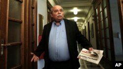 Greek Minister of Interior and Administrative Reconstruction Nikos Voutsis arrives for a cabinet meeting at the parliament in Athens, May 12, 2015. 