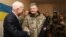 Ukrainian President Petro Poroshenko (R) shakes hands with U.S. Senator John McCain during a meeting with Ukrainian servicemen in Shirokino settlement near Mariupol, Ukraine, Dec. 31, 2016.