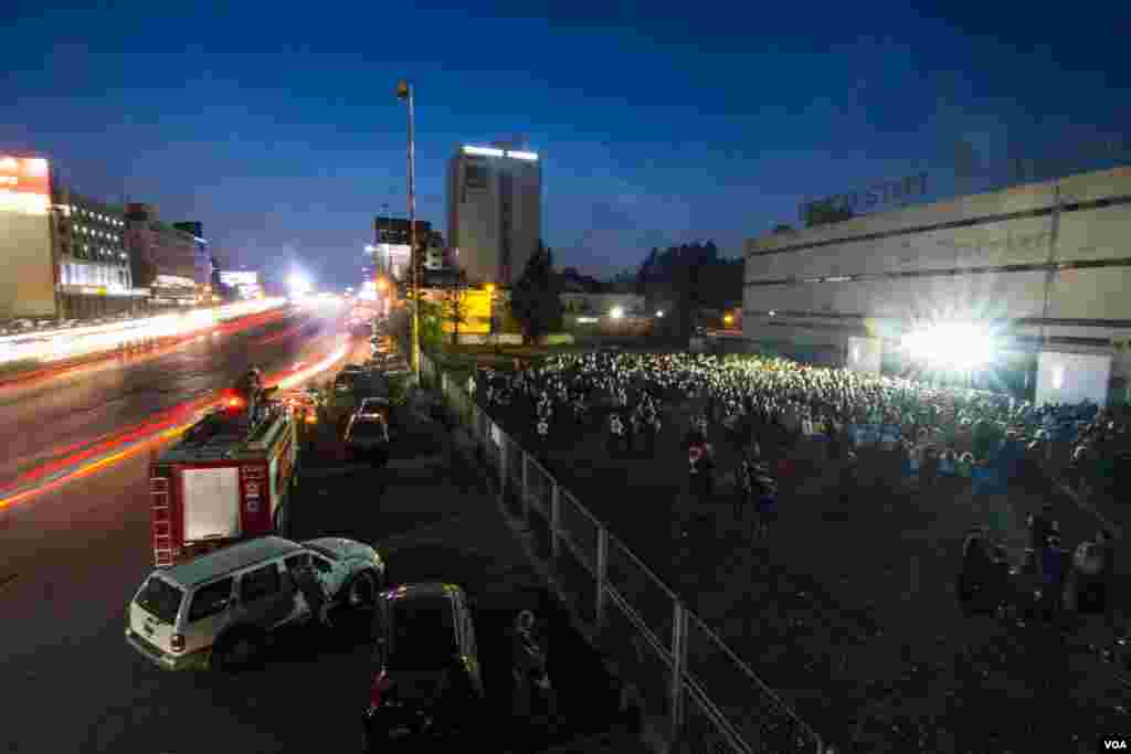 People gather for one of a number of events marking the centenary. During this event, a video showed other massacres that have taken place in the last 100 years. (John Owen/VOA)