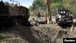 A Malian soldier walks into a military camp used by radical Islamists and bombarded by French warplanes, in Diabaly, North of the capital Bamako, January 21, 2013. 