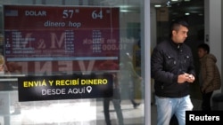 A man walks out from a currency exchange shop in Buenos Aires, Argentina, Oct. 29, 2019. 