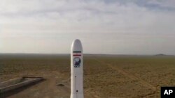 FILE - In this image taken from video, an Iranian rocket carrying a satellite is launched from an undisclosed site, believed to be in Iran's Semnan province, April 22, 2020. 