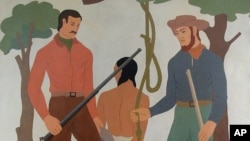 FILE - The University of Idaho in 2015 decided to cloak this controversial mural, created in the 1930s by WPA artist Ivan Bartlett, which depicts the lynching of a Native American. Once the Boise, Idaho, building served as the Ada County Courthouse. Today