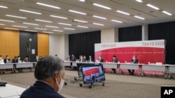President of the Tokyo 2020 Organizing Committee of the Olympic and Paralympic Games Seiko Hashimoto delivers opening remarks during a Tokyo 2020 executive board meeting in Tokyo Wednesday, May 26, 2021. (Nicolas Datiche/Pool Photo via AP)