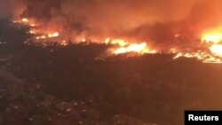 Aerial view of an area affected by wildfire in Redding, California, U.S. July 26, 2018, in this still image taken from a video obtained from social media. 