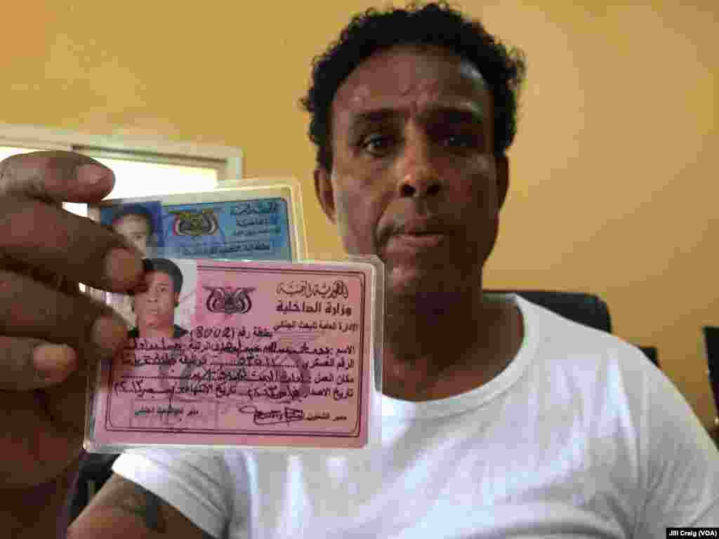 A Yemeni refugee shows his national identification cards at the center for the Yemen Community, in Hargeisa, Somaliland, March 30, 2016.