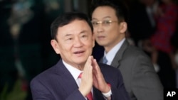 FILE - Thailand's former Prime Minister Thaksin Shinawatra, arrives at Don Muang airport in Bangkok, Thailand, Aug. 22, 2023. Thai prosecutors on May 29, 2024, said Thaksin will be indicted for defaming the monarchy, three months after he was freed on parole on other charges. 