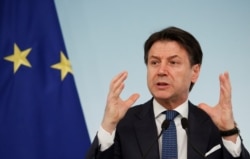 FILE - Italian Prime Minister Giuseppe Conte speaks during a news conference due to coronavirus spread, in Rome, Italy, March 11, 2020.