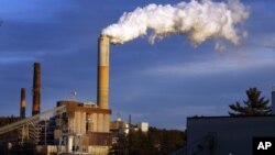 FILE - A plume of steam billows from the coal-fired Merrimack Station in Bow, N.H., Jan. 20, 2015.