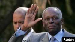 FILE PHOTO: Angola's President Jose Eduardo dos Santos waves as he leaves Sao Bento Palace after a meeting with Portuguese Prime Minister Jose Socrates in Lisbon