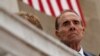FILE - Former Sen. Bob Dole watches as President Donald Trump speaks during a Memorial Day ceremony at Arlington National Cemetery, May 29, 2017, in Arlington, Virginia.