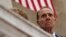 FILE - Former Sen. Bob Dole watches as President Donald Trump speaks during a Memorial Day ceremony at Arlington National Cemetery, May 29, 2017, in Arlington, Virginia.
