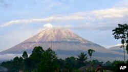 Mount Semeru is seen in Lumajang district, East Java province, Indonesia, Saturday, Dec. 18, 2021. 
