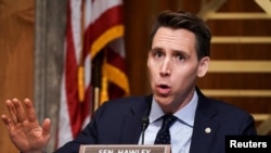 FILE - Sen. Josh Hawley, R-Mo., asks questions during a hearing in Washington, Dec. 16, 2020.