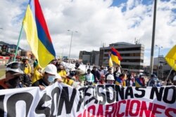 Thousands of people take to the streets in anti-government protests, in Bogota, Colombia, July 20, 2021. (Megan Janetsky/VOA)