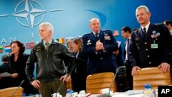 NATO commanders await the start of the NATO Ministerial Meeting on the South, Partnerships, and Defense Capacity at NATO Headquarters in Brussels, Dec. 1, 2015. 