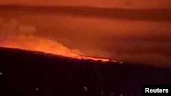 A general view of Hawaii's Mauna Loa volcano, in Kailua-Kona, Hawaii, U.S., November 28, 2022 in this screen grab taken from a social media video. (kelly/ @MAGAHAWAII/via REUTERS)