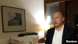 Gasser Abdel Razek, Executive Director of the Egyptian Initiative for Personal Rights (EIPR) speaks during an interview with Reuters in his home in Cairo, Egypt, Dec. 4, 2020.