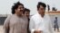 FILE PHOTO: Ali Wazir, left, and Mohsin Dawar, leaders of the Pashtun Tahaffuz Movement (PTM) walk at the venue of a rally against, what they say, are human rights violations by security forces, in Karachi, Pakistan, May 13, 2018. 