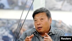 卢广2014年出席山西平遥国际摄影展。