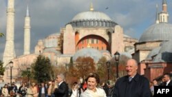 King Harald and Queen Sonja of Norway pose in front of Hagia Sophia Mosque on November 7, 2013 in Istanbul, Turkey. 
