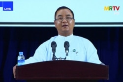 Junta spokesman Brigadier General Zaw Min Tun speaks during a live press conference in Naypyidaw, April 9, 2021, in this screengrab provided via AFPTV and taken from a broadcast by Myanmar Radio and Television in Myanmar.