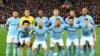 Para pemain Manchester City berpose untuk foto keluarga sebelum pertandingan sepak bola perempat final leg pertama Liga Champions antara Liverpool dan Manchester City, di stadion Anfield di Liverpool, 4 April 2018. (Foto: AFP/Paul Ellis)