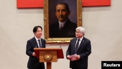 Taiwan's president Lai Ching-te, left, and C.C Wei, Chairman and CEO of TSMC, hold a press conference at Taiwan's presidential office in Taipei, Taiwan, March 6, 2025. 