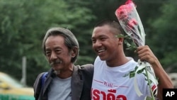 FILE - Thai law student Jatupat Boonpattararaksa, right, and his father Viboon Boonpattararaksa in Bangkok, Thailand.
