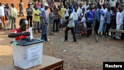 FILE - A man casts his vote at a polling station during presidential elections in Accra, Ghana, Dec. 7, 2012. 