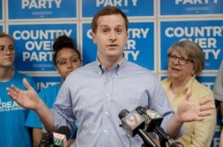 FILE - Dan McCready, the Democratic candidate in the North Carolina 9th Congressional District race, speaks at a news conference in Charlotte, N.C., May 15, 2019.