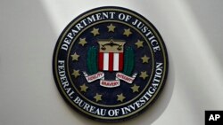 FILE - An FBI seal is displayed on a wall in Omaha, Nebraska, Aug. 10, 2022.
