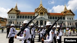 Soldiers are seen during a changing of the guard inside the Grand Palace days before the King's coronation in Bangkok, Thailand Apr. 30, 2019. 