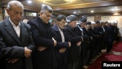 FILE - Muslim worshippers perform the dawn prayer inside a mosque in the Kurdish town of Halabja, Iraq, Jan. 28, 2019.