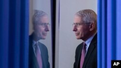 FILE - Dr. Anthony Fauci, director of the National Institute of Allergy and Infectious Diseases, arrives to speak about the coronavirus in the James Brady Press Briefing Room of the White House, in Washington, April 22, 2020.