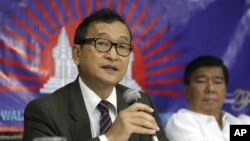 Rainsy left Cambodia in 2009 before two court cases, both of which related to the country’s contentious, ill-defined border with Vietnam.
