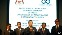 Malaysian Minister of Transport Liow Tiong Lai, center, speaks at a press conference during MH370 missing plane search operations signing ceremony between the government of Malaysia and the Ocean Infinity Limited in Putrajaya, Malaysia, Jan. 10, 2018. 